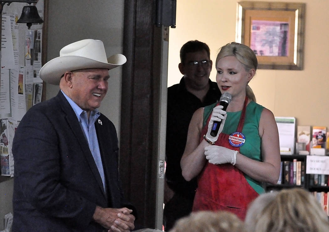 Horace Langford Jr./Pahrump Valley Times Dennis Hof (left) stands with Food Network "Chopped" star Jessica Johnson (right) at the Pahrump Senior Center on May 11, 2018. The Hof campaign hosted th ...