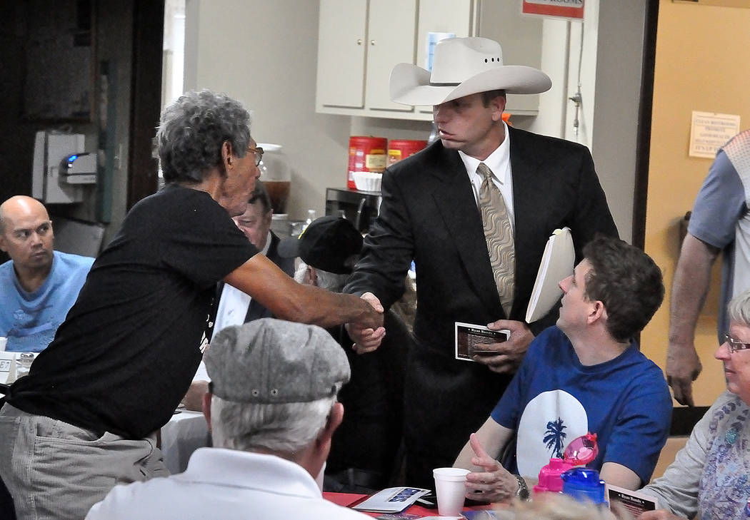 Horace Langford Jr./Pahrump Valley Times Ryan Bundy (right), candidate in the 2018 Nevada governor's race, shakes hands with attendees of an event put on by the Dennis Hof campaign on May 11, 201 ...