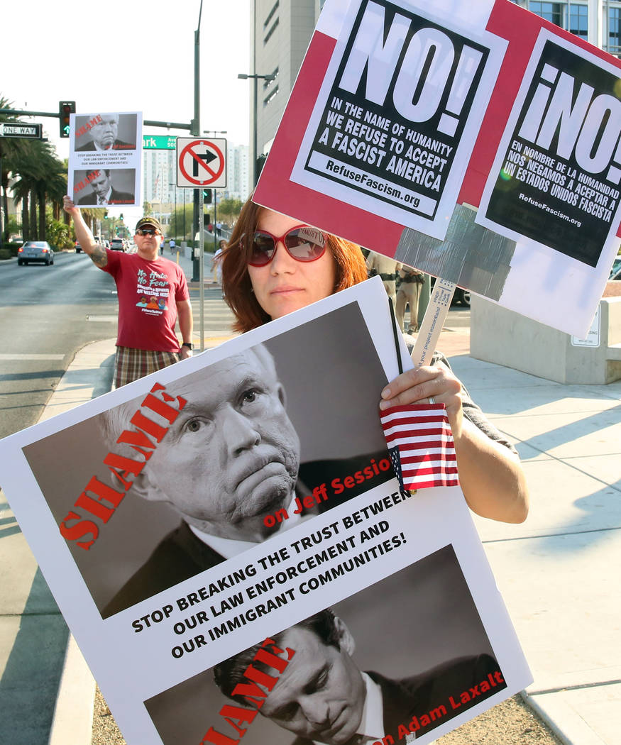 Bizuayehu Tesfaye/Las Vegas Review-Journal A protester, who declined to give her name, protests against a ban on sanctuary cities outside a federal building in downtown Las Vegas where U.S. Attorn ...