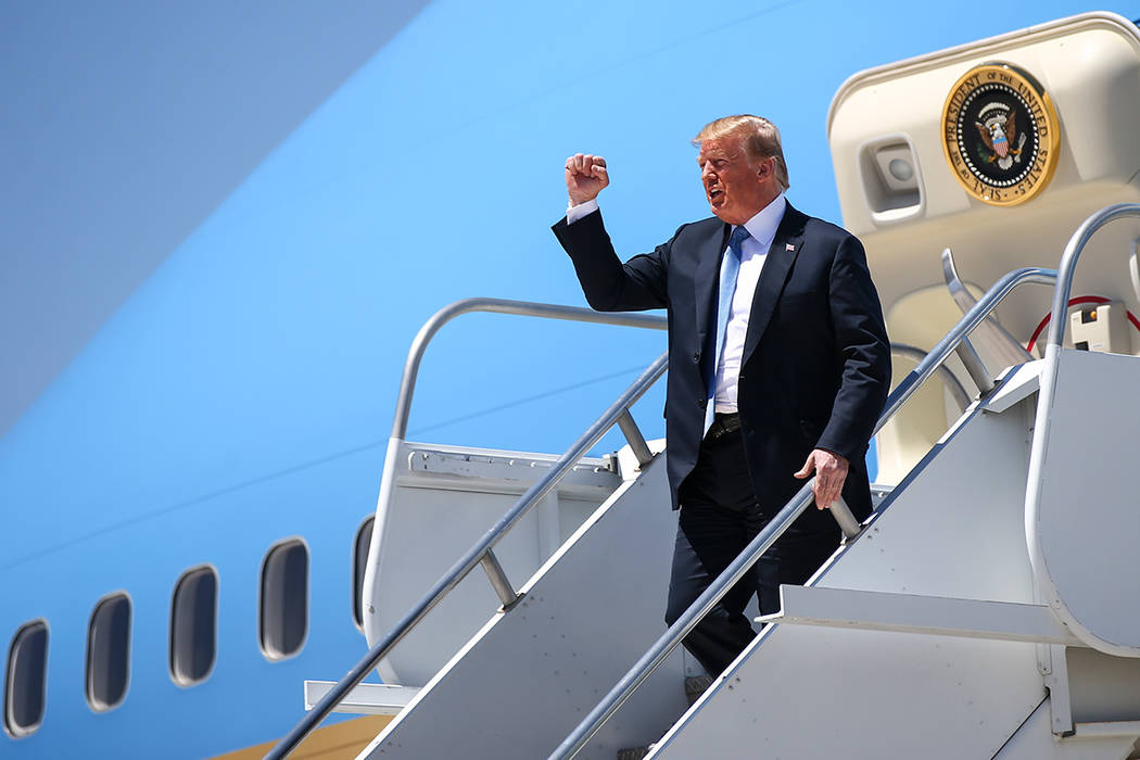 President Donald Trump reacts as he arrives at McCarran International Airport in Las Vegas on Saturday, June 23, 2018. Chase Stevens Las Vegas Review-Journal @csstevensphoto
