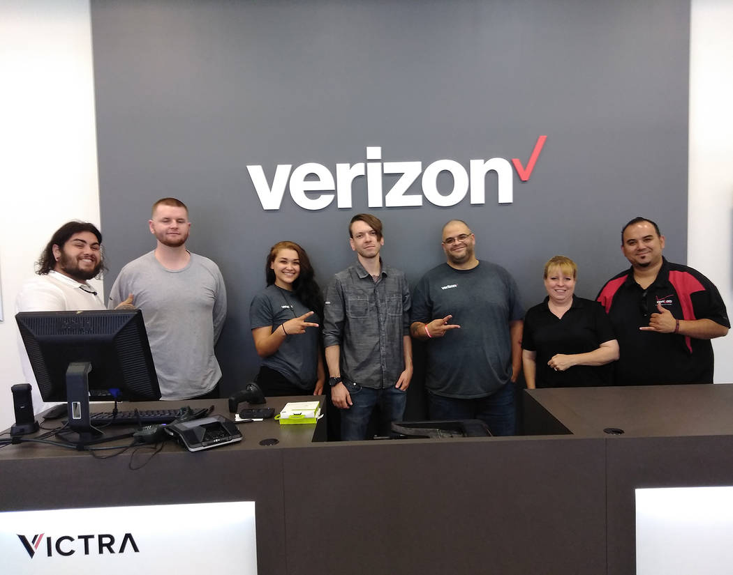 Selwyn Harris/Pahrump Valley Times Verizon District Sales Manager for Nevada Mitchell Muna, far right, and staff is hosting a grand opening for the store's new location at 200 S. Highway 160, suit ...