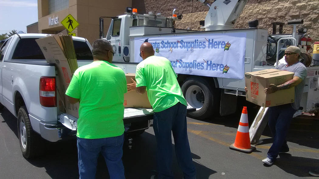 Selwyn Harris/Pahrump Valley Times Volunteers load boxes full of school supplies during the 2017 "Fill the Bucket" campaign. The Valley Electric Association (VEA) sponsored annual event collected ...