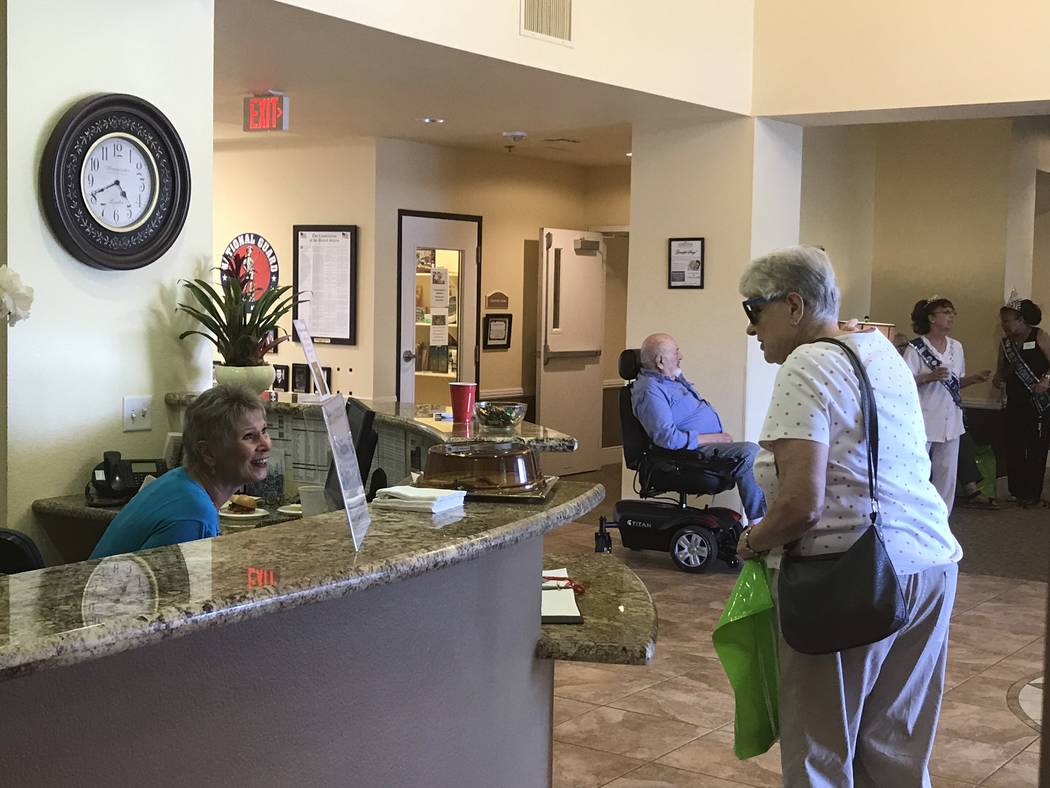 Jeffrey Meehan/Pahrump Valley Times Attendees of an open house event at Inspirations Senior Living in Pahrump check in for the three-hour long gathering on July 19, 2018. Several dozen people show ...
