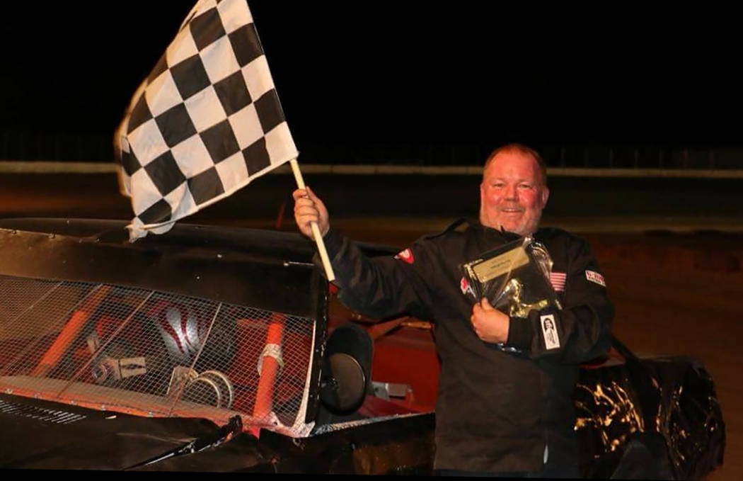 Dale Geissler/Pahrump Valley Times Anthony Mann celebrates ending Gary Wyatt's long winning streak in the Bombers division Saturday night at Pahrump Valley Speedway.