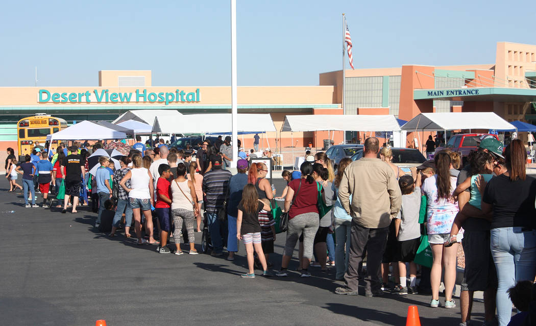Robin Hebrock/Pahrump Valley Times A massive line of Pahrump Valley families is shown in front of Desert View Hospital just before the start of the Back to School Health Fair.