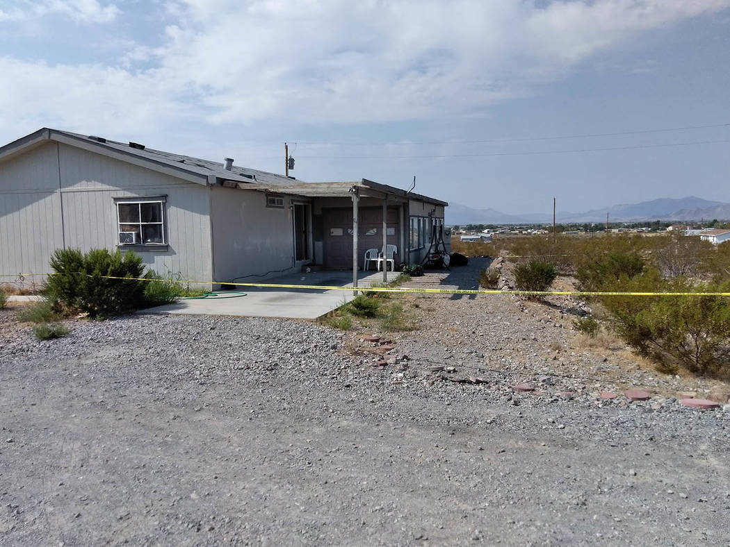 Selwyn Harris/Pahrump Valley Times Yellow crime scene tape surrounds the property where authorities were investigating the death of Pahrump resident Dawn Liebig, 46, on Wednesday. Nye County detec ...