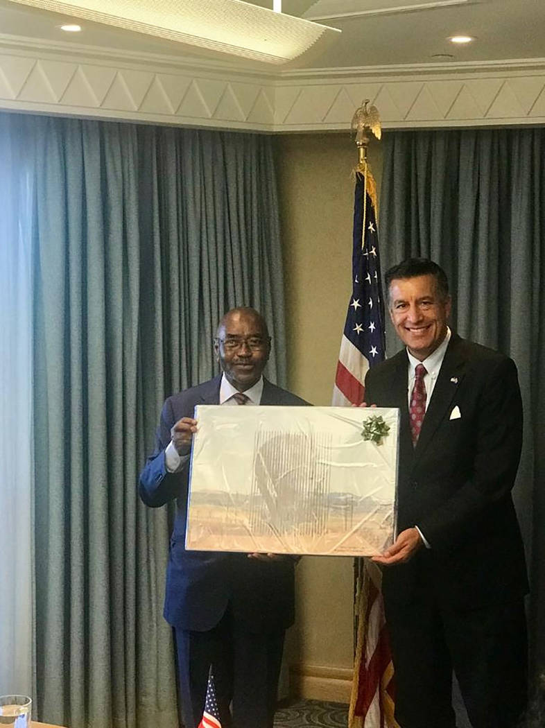 Nevada Governor's Office for Economic Development Nevada Gov. Brian Sandoval is shown taking part in a gift exchange with Premier Thembinkosi Willies Mchunu of Kwazulu Natal.