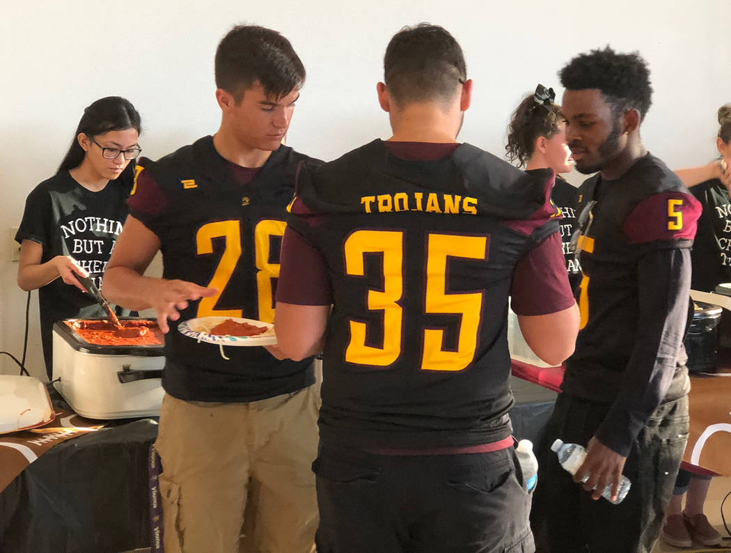 Tom Rysinski/Pahrump Valley Times Varsity football players, including Dylan Grossell (28), Nico Velazquez (35) and Casey Flennory (5), were the first in line at the spaghetti dinner, as they were ...