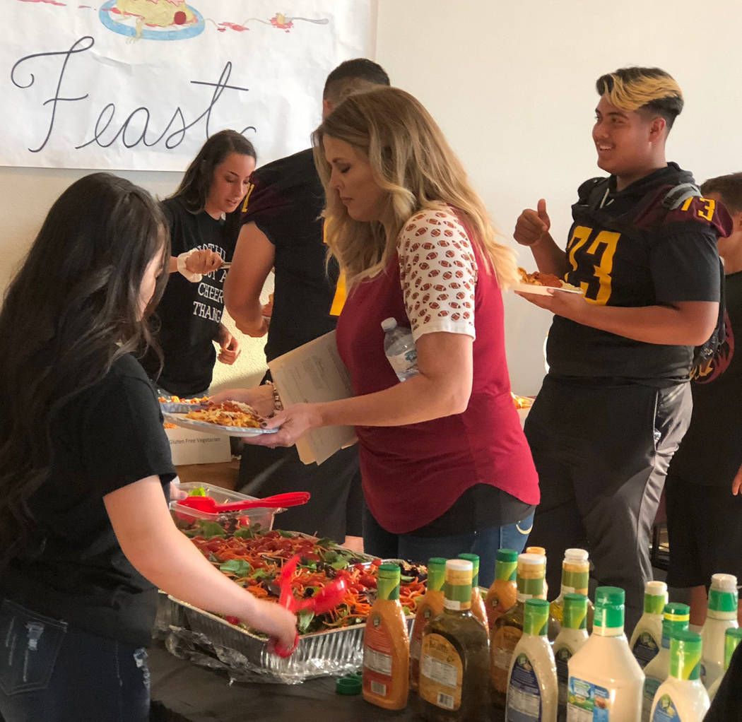 Tom Rysinski/Pahrump Valley Times Holly Clayton, center, was the primary organizer of the annual fundraiser, which brought in more than $10,000 for the Pahrump Valley High School football team.