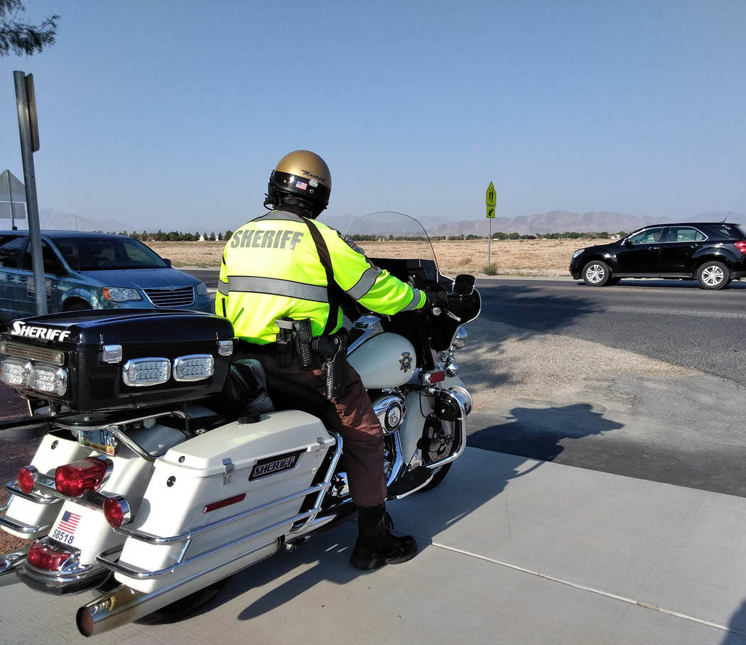 Selwyn Harris/Pahrump Valley Times As Assistant Superintendent Lindberg was voicing his concern about student safety at bus stops and school campuses, a Nye County Sheriff’s Office motorcycle de ...