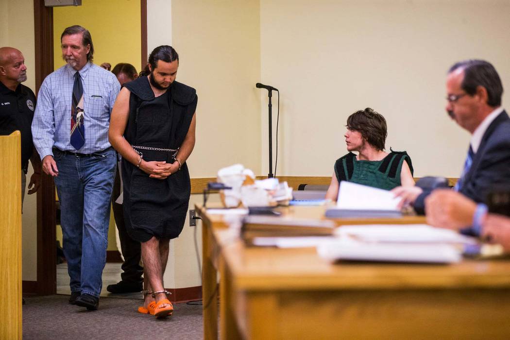 A shackled Dakota Saldivar enters the courtroom while his brother, Michael Wilson, sits at a table in Pahrump Justice Court on Thursday, Aug. 9, 2018. The 17-year-olds were in court for an arraign ...