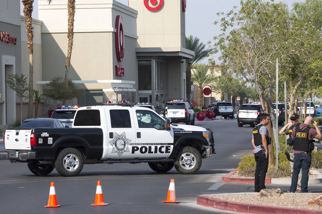 Police investigate an officer-involved shooting at a shopping complex near Blue Diamond Road and Arville Street in Las Vegas on Saturday, Aug. 11, 2018. Richard Brian Las Vegas Review-Journal @veg ...