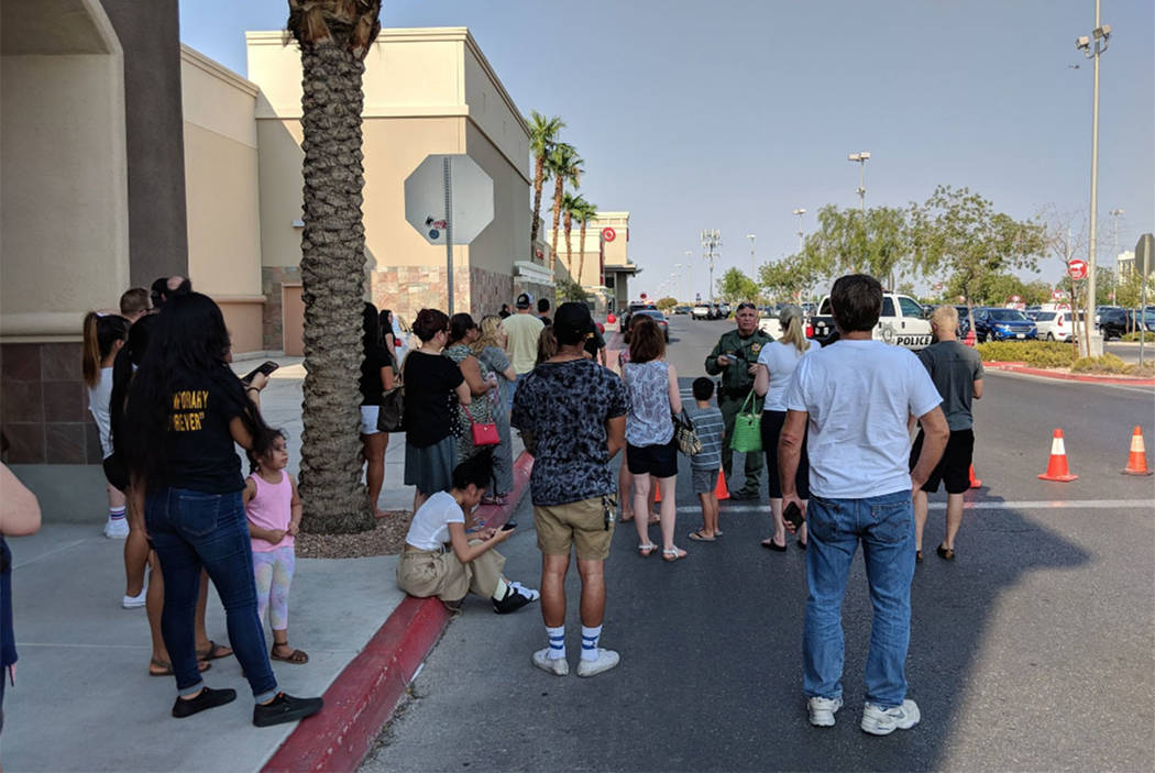 Shoppers wait outside at Blue Diamond Crossing shopping center on Blue Diamond Road in Las Vegas on Saturday, Aug. 11, 2018. (Richard Brian/Las Vegas Review-Journal)