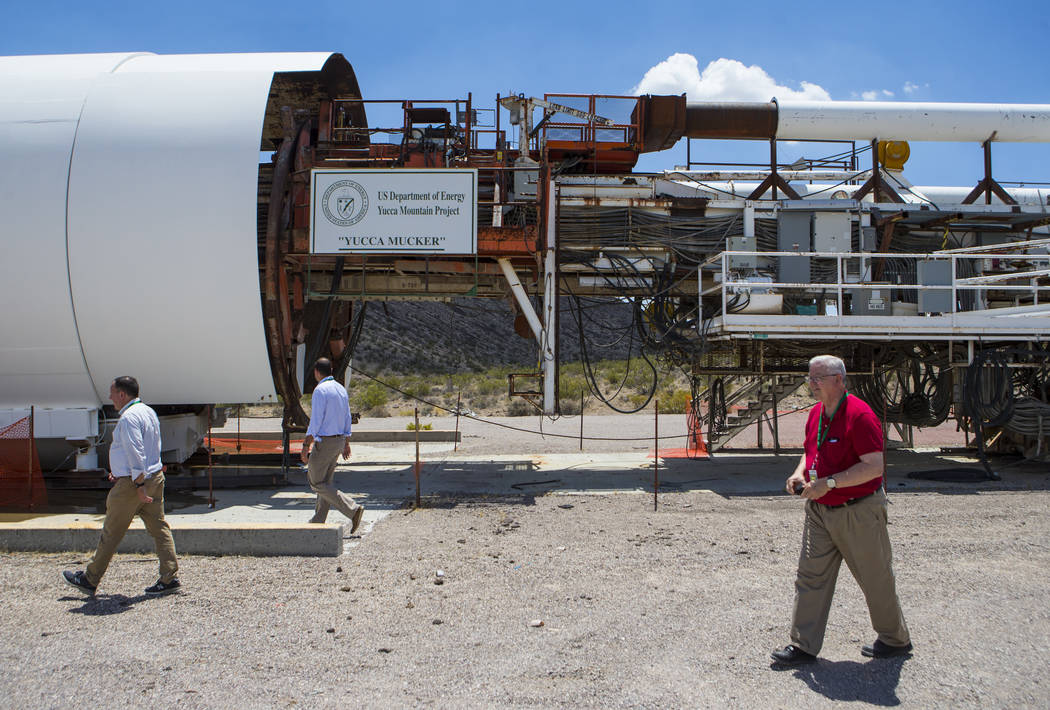 People walk by the Yucca Mucker, which bore the tunnel through Yucca Mountain, during a congressional tour of the area near Mercury on Saturday, July 14, 2018. Chase Stevens Las Vegas Review-Journ ...