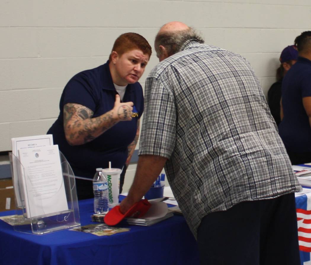 Robin Hebrock/Pahrump Valley Times Pahrump Veterans Service Officer Brandi Matheny is pictured in conversation with a local veteran. She is a key resource for former military personnel seeking to ...