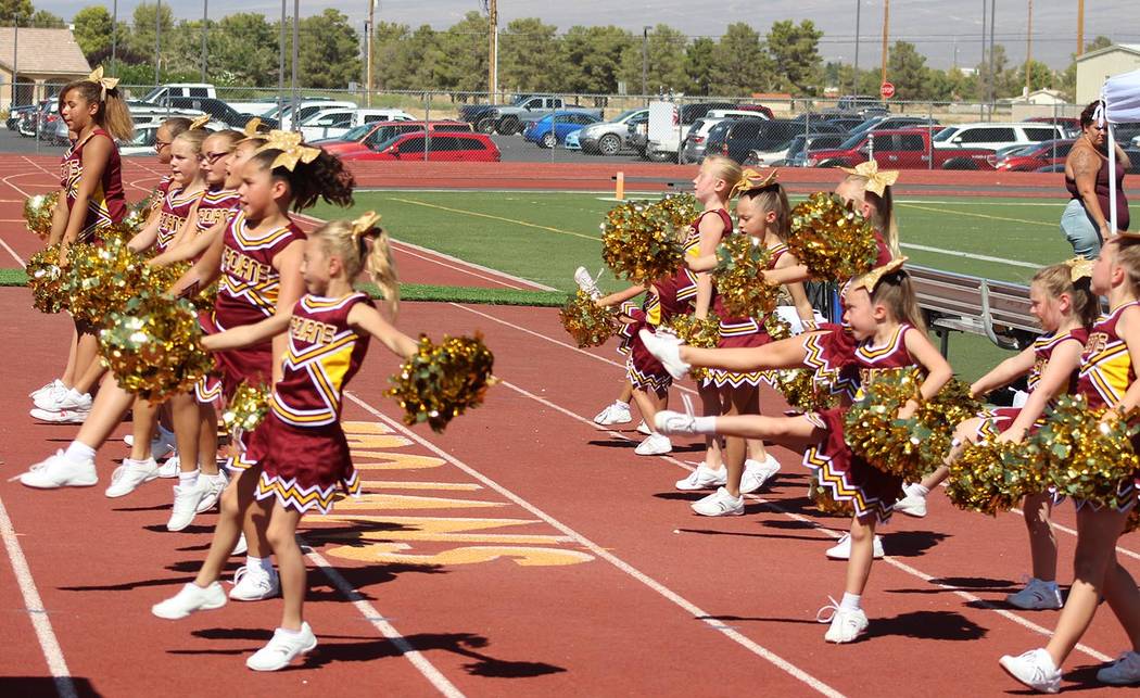 Tom Rysinski/Pahrump Valley Times The Junior Trojans Cheerleaders are an integral part of the scene at National Youth Sports Nevada football games.