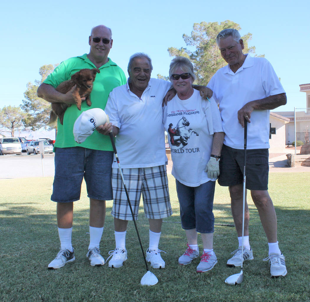 Robin Hebrock/Pahrump Valley Times Teams of four, such as the happy quartet shown, took part in the Silver Tappers Golf Tournament, helping add to the cash being collected for Nye County Search an ...