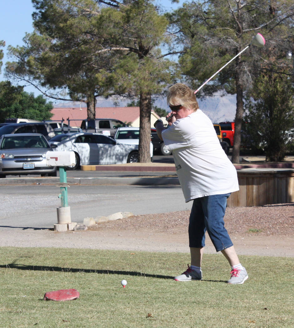 Robin Hebrock/Pahrump Valley Times A golfer tees off at the first hole for her team.