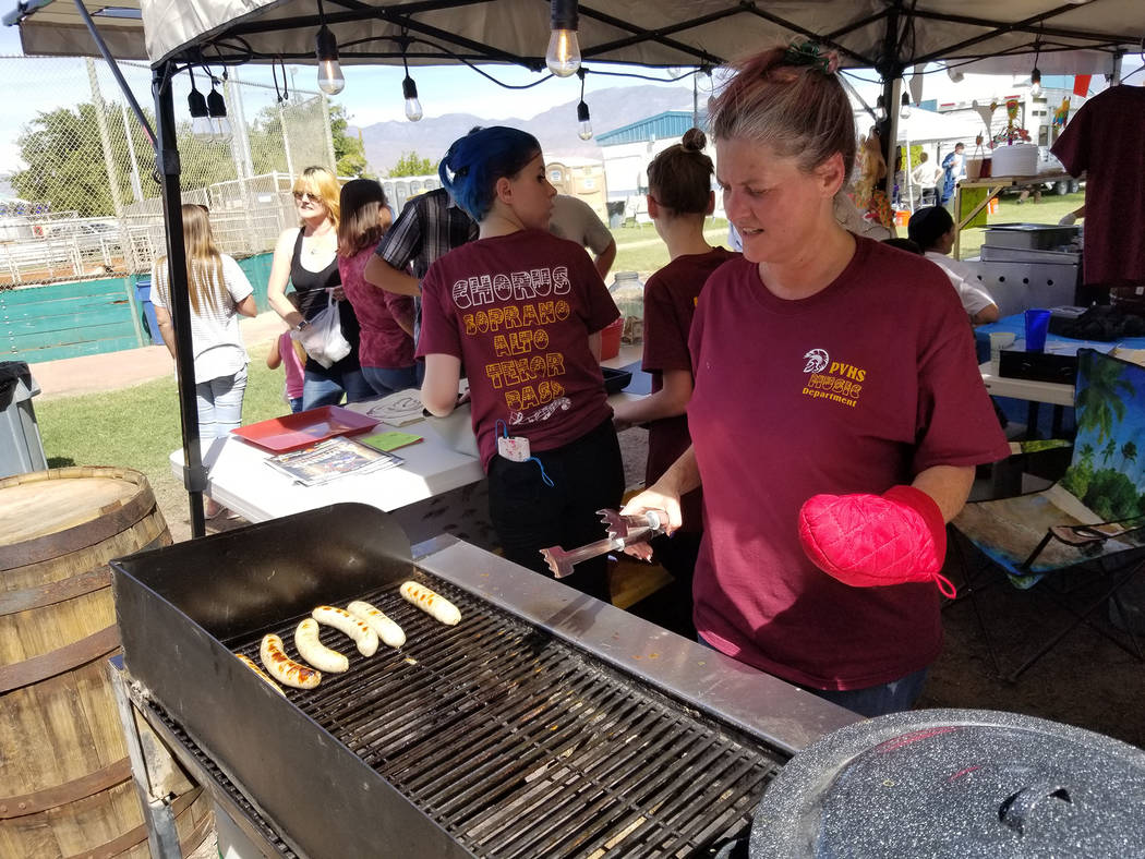 David Jacobs/Pahrump Valley Times Juli McLeish of the Pahrump Valley High School booster club is shown cooking at the Pahrump Fall Festival. The club had a vendor booth at the festival in Petrack ...