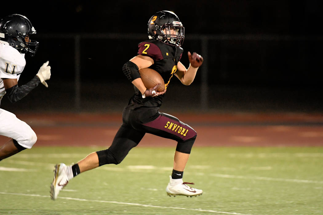Peter Davis/Special to the Pahrump Valley Times Pahrump Valley senior Joey Koenig scampers toward the end zone for a 51-yard touchdown Friday night against Cheyenne. Koenig ran for two scores and ...