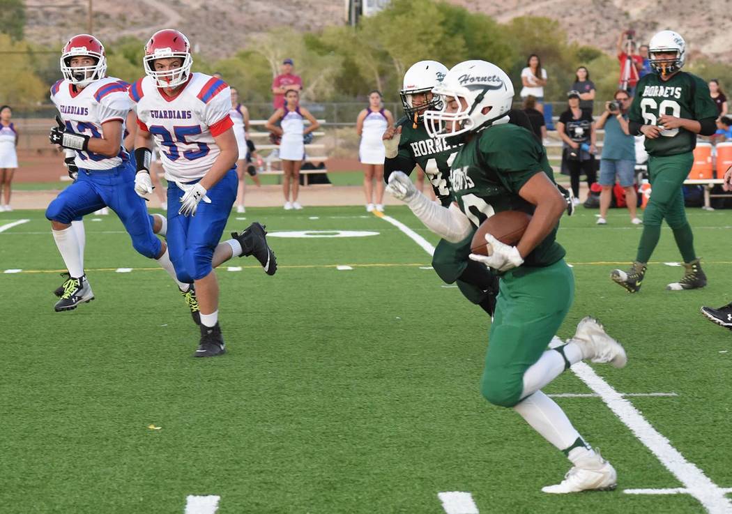 Richard Stephens/Special to the Pahrump Valley Times Beatty junior Fabian Perez finds running room against the Green Valley Christian defense Thursday during the Hornets' 40-6 win over the Guardians.
