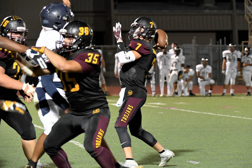 Peter Davis/Specail to the Pahrump Valley Times Dylan Wright goes back to pass during Pahrump Valley's key Class 3A Sunset League victory over Cheyenne on Friday night in Pahrump.