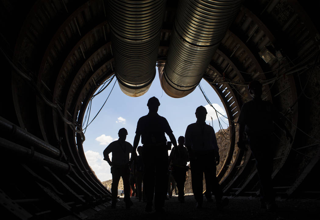 Chase Stevens/Las Vegas Review-Journal Members of a congressional tour make their way through the south portal of Yucca Mountain near Mercury on Saturday, July 14, 2018.