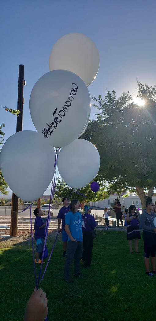 Special to the Pahrump Valley Times A Walk In Memory, Walk For Hope attendee holds several balloons in readiness for the balloon release, a traditional part of the annual suicide prevention and aw ...