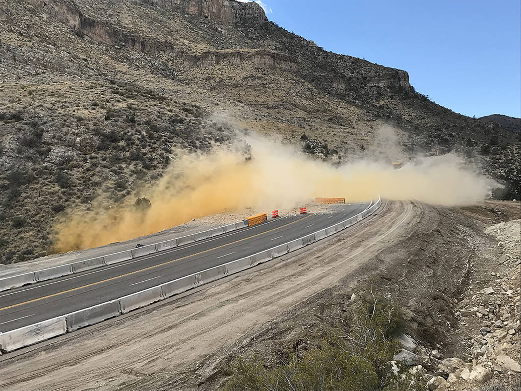 Nevada Department of Transportation A blast is shown along Nevada Highway 160 on Oct. 5 as crews continue their work on the project.