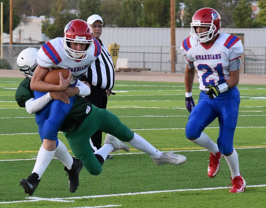 Richard Stephens/Special to the Pahrump Valley Times Beatty's Jacob Henry makes a tackle against Green Valley Christian. Henry ran for two touchdowns and passed for another last Friday as the Horn ...