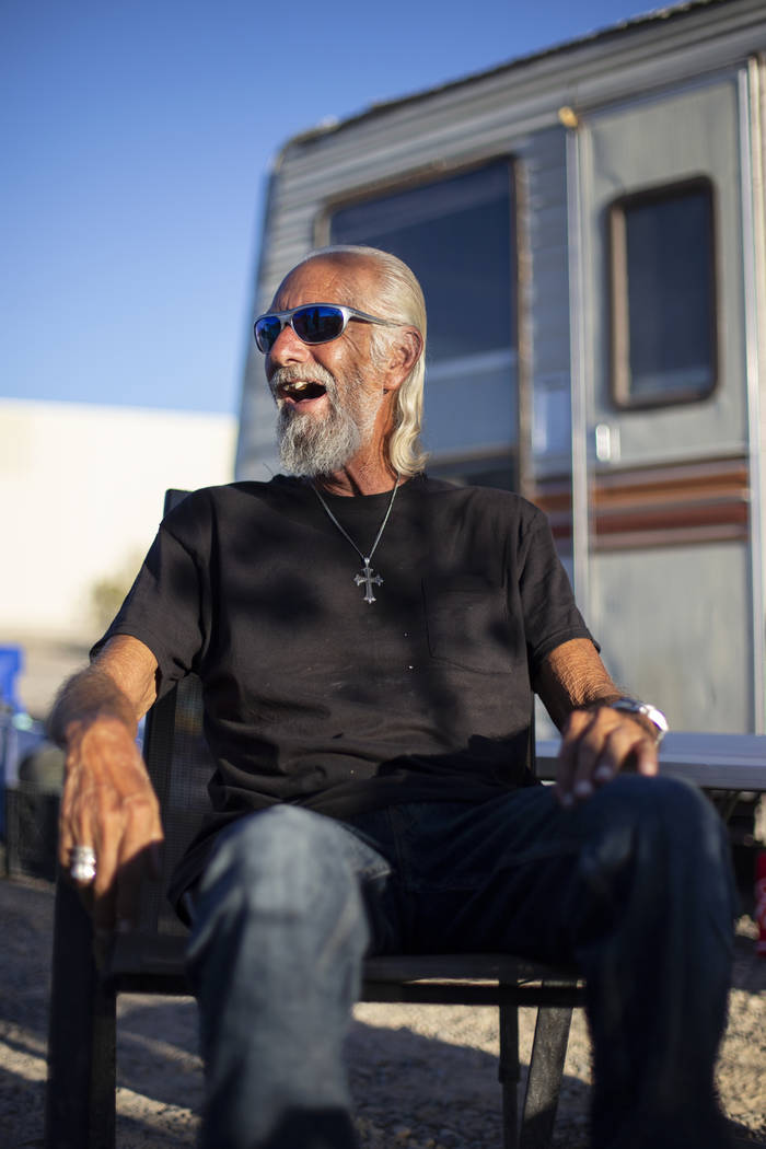 Homeless resident Rich enjoys a beverage outside of his trailer that sits on a lot west of the Nugget property where him and several others have temporarily relocated in Pahrump, Wednesday, Sept. ...