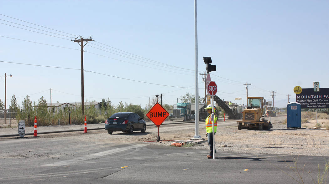 Robin Hebrock/Pahrump Valley Times Flaggers are shown along Homestead Road in Pahrump earlier this year. Flaggers are there not only to protect road construction workers but also to protect driver ...