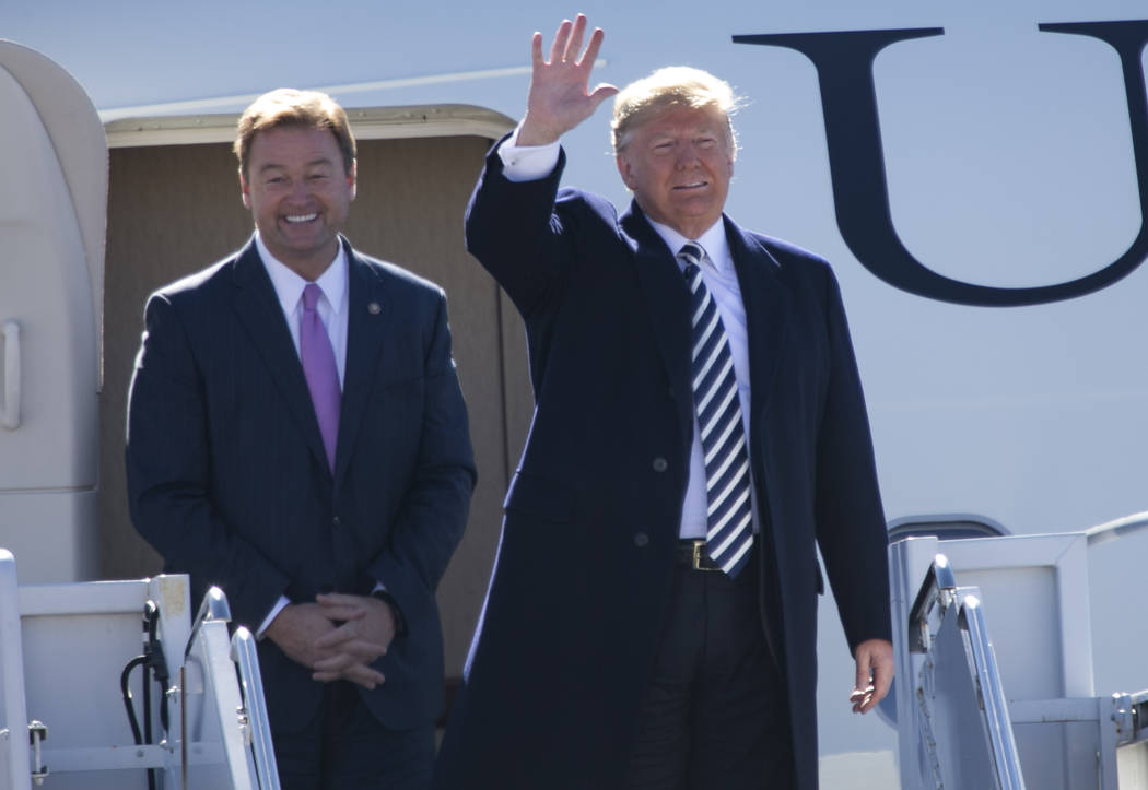 President Donald Trump, right, arrives with Sen. Dean Heller, R-Nev., on Air Force One before a Make America Great Again Rally in Elko, Nev., on Saturday, Oct. 20, 2018. Richard Brian Las Vegas Re ...