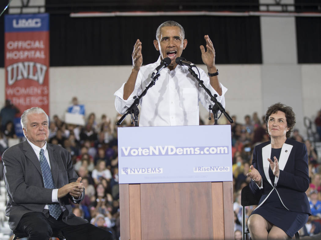 Former President Barack Obama, middle, speaks during a rally at Cox Pavilion on Monday, Oct. 22, 2018, in Las Vegas. Benjamin Hager Las Vegas Review-Journal