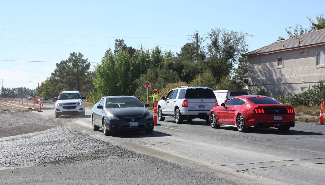 Robin Hebrock/Pahrump Valley Times Vehicles traveling southbound on Pahrump Valley Boulevard wait while flaggers allow traffic moving northbound to access the single open lane.