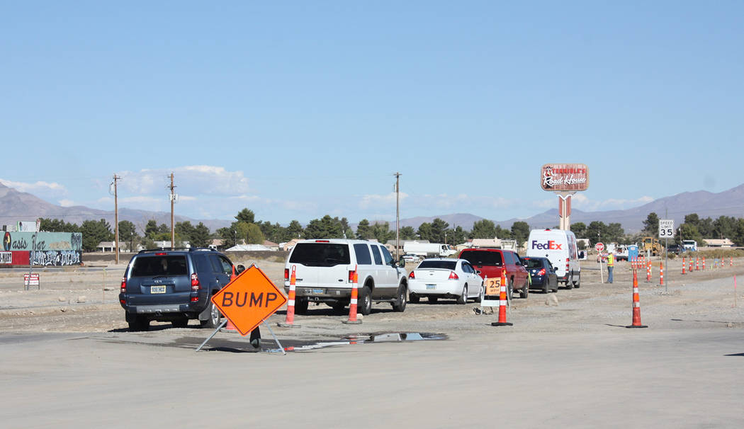 Robin Hebrock/Pahrump Valley Times A line of cars heading north on Pahrump valley Boulevard between Calvada Boulevard and Highway 372 waits for the flagger to motion them to proceed in this photo, ...