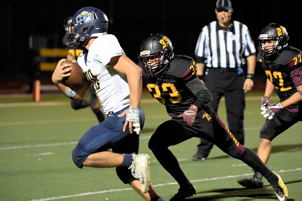 Peter Davis/Special to the Pahrump Valley Times Pahrump Valley's Jalen Denton moves in on Bould ...