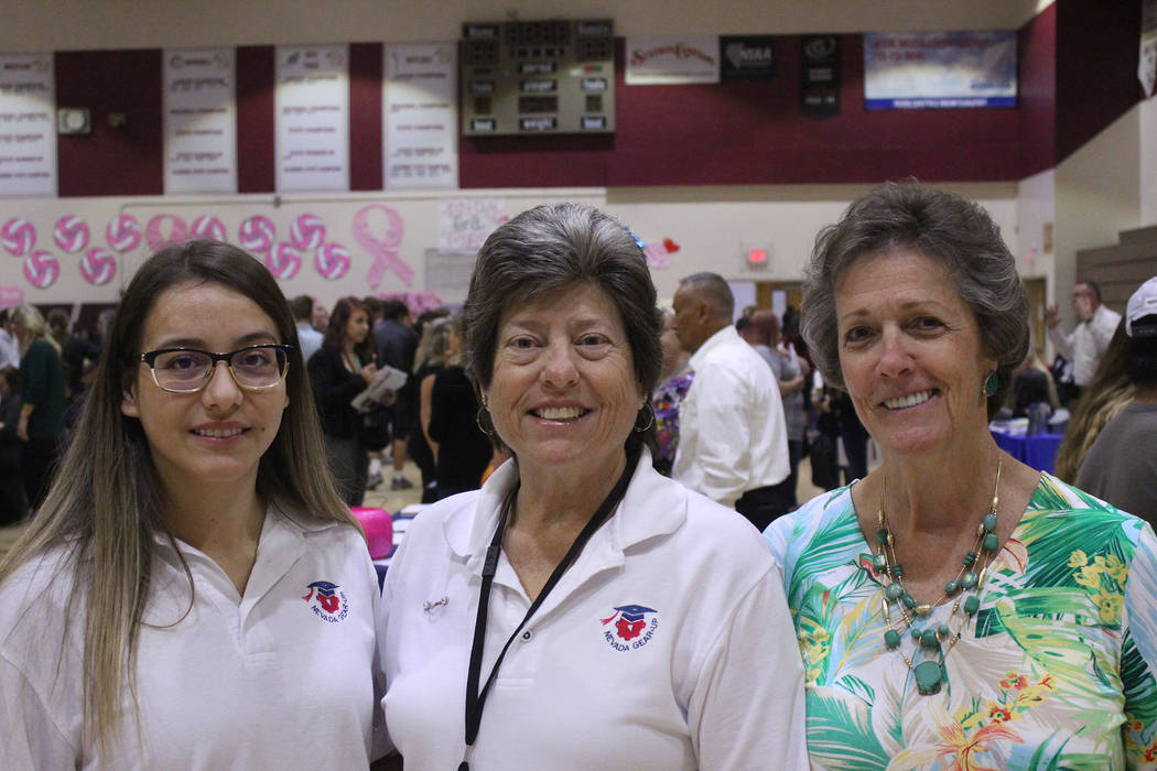 Jeffrey Meehan/Pahrump Valley Times Lisa Hamrick, GEAR UP site representative at Pahrump Valley High School (center) stands with Carlah Luck, 12th grade counselor at the college and career fair on ...