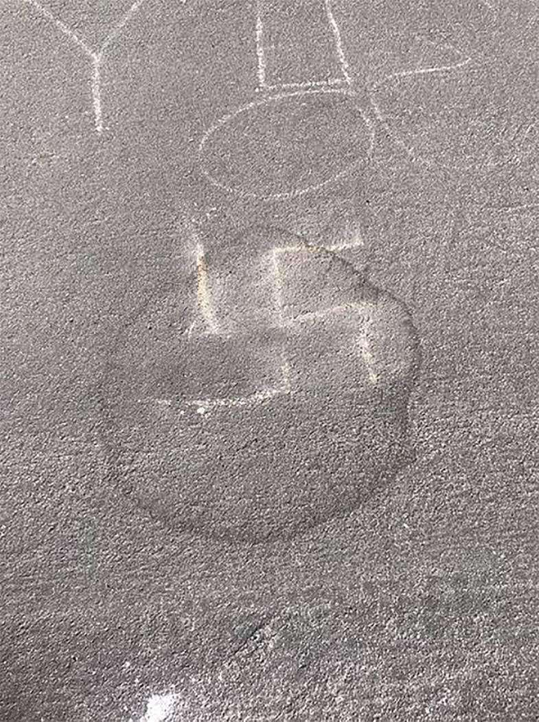 Special to the Pahrump Valley Times Local resident Rebecca McCullough did not notice a swastika drawn in front of her home on Tuesday afternoon after picking her kids up from school. She said the ...