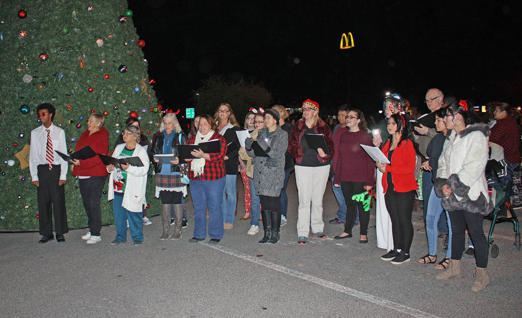 Robin Hebrock/Pahrump Valley Times Members of the High Desert Chorale and the Pahrump Valley High School Choir serenaded the attendees of the Community Christmas Tree Lighting ceremony.