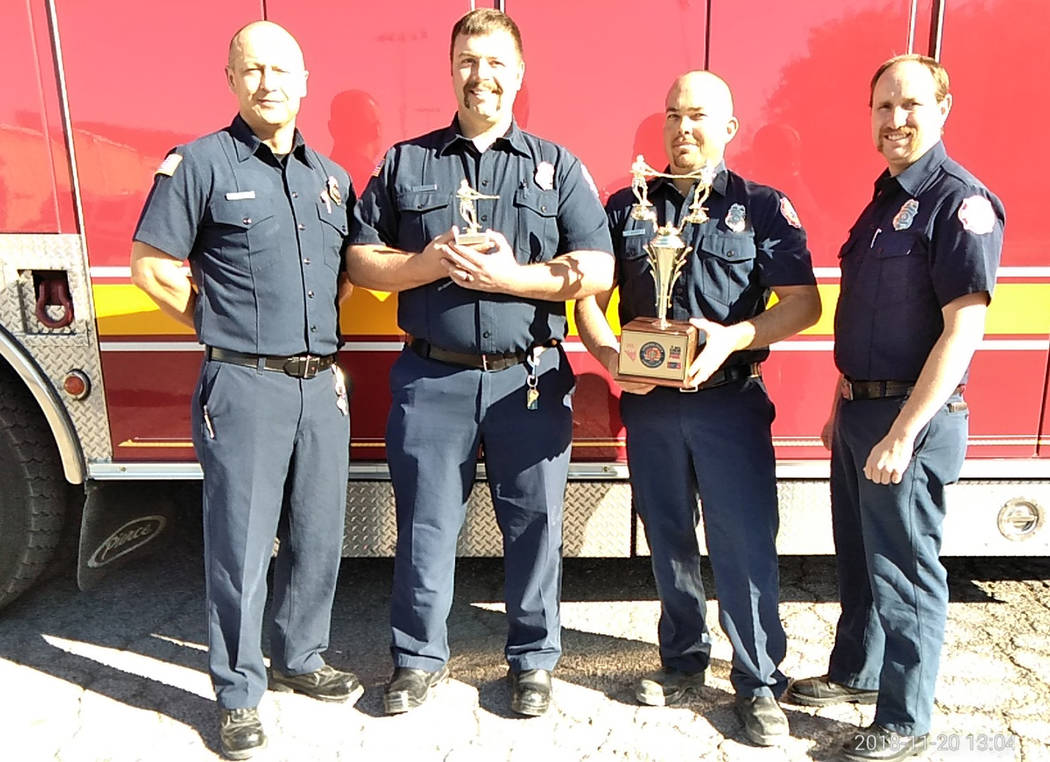 Selwyn Harris/Pahrump Valley Times From left, Pahrump Valley Fire and Rescue Services firefighters James Woodard, Jared Orum, James Rosen and Kurt Overall took home top honors, by pulling a fully ...