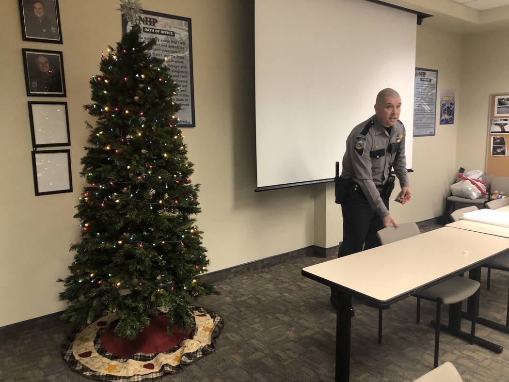 Nevada Highway Patrol Lt. Anthony Munoz at the patrol's southern command graveyard shift briefing late Friday, November 31, 2018. Munoz introduced troopers to this year's Life Saving Tree, a Chris ...