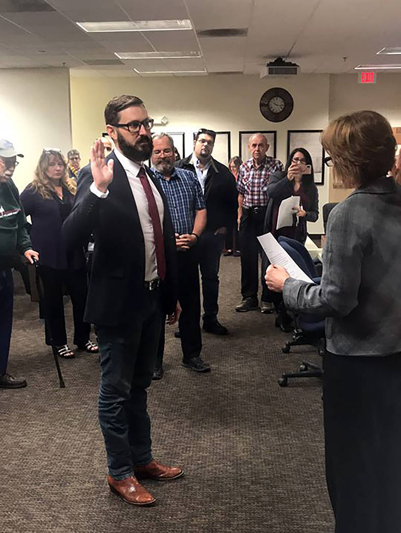 Special to the Pahrump Valley Times Greg Hafen II is pictured taking his oath of office in front of Nye County Clerk Sandra Merlino and officials from Nye, Clark and Lincoln counties. He was sworn ...