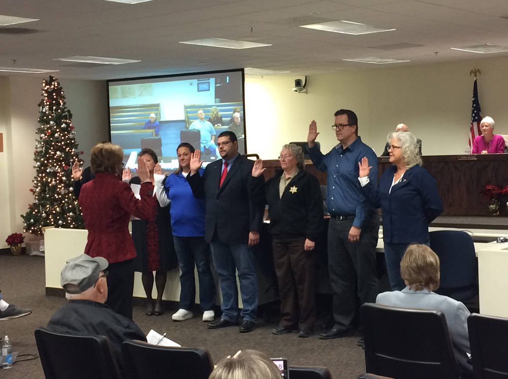 Robin Hebrock/Pahrump Valley Times Debra Strickland, far right, takes her oath of office beside several other newly elected Nye County officials on Dec. 18, 2018.
