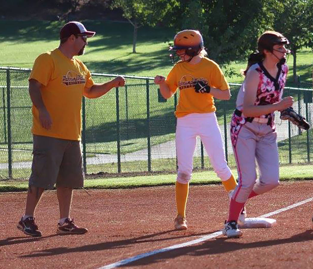 Cassondra Lauver/Special to the Pahrump Valley Times Rich Lauver congratulates Evandy Murphy after a triple during a U16 softball game against the Southern Utah Rebels.
