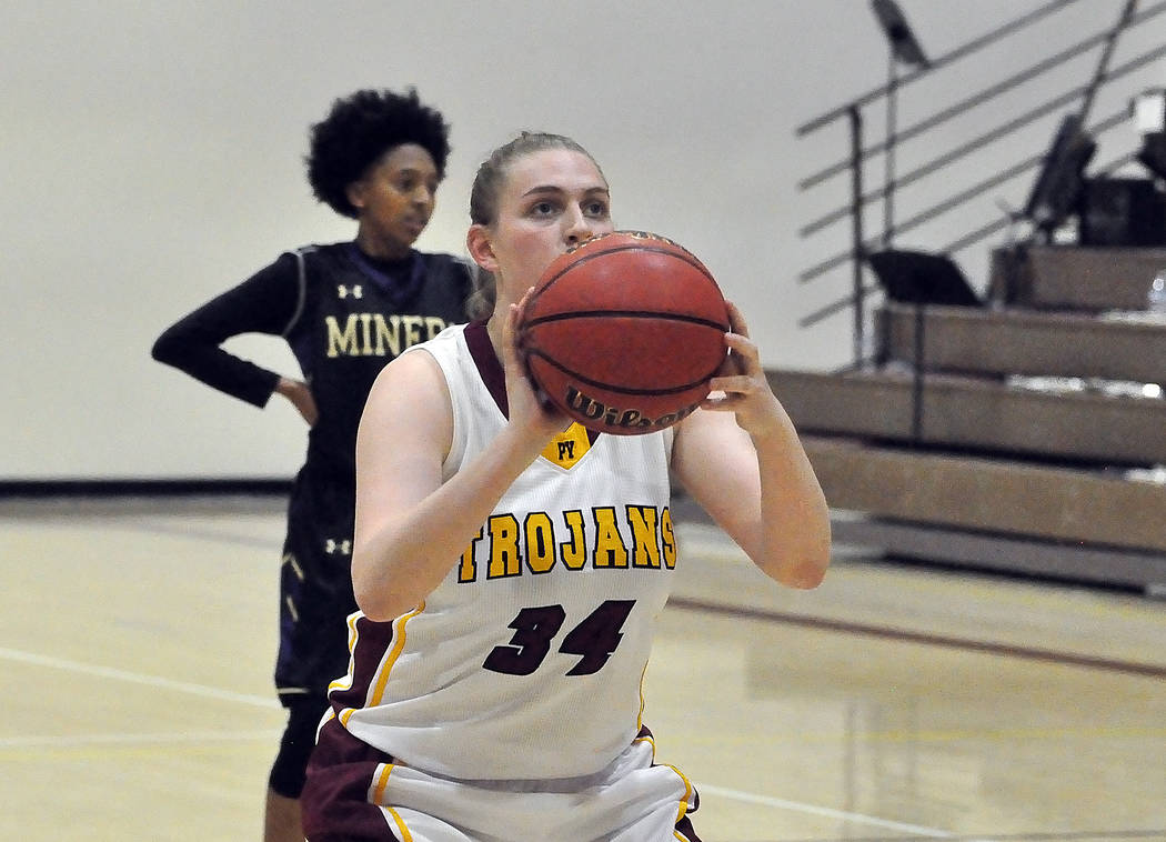 Horace Langford Jr./Pahrump Valley Times Junior forward Kylie Stritenberger lines up a free throw during a December game against Sunrise Mountain. Stitenberger scored 8 points as the Trojans defea ...