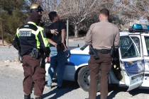 Selwyn Harris/Pahrump Valley Times Nye County Sheriff’s deputies prepare to transport suspec ...