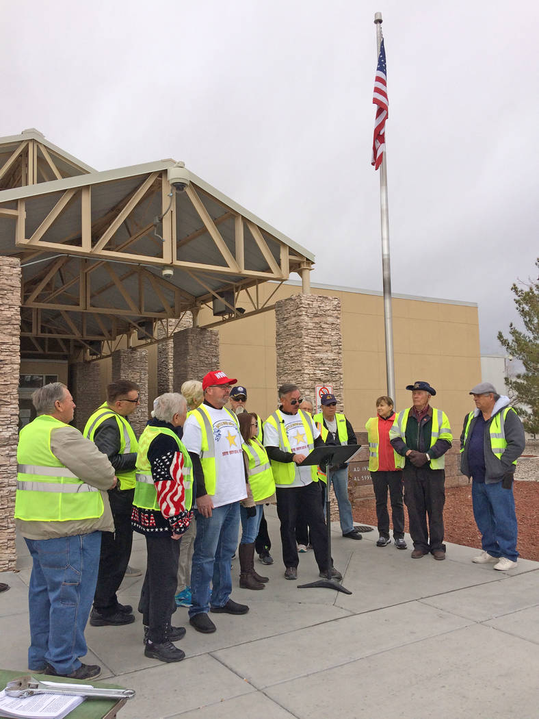 Robin Hebrock/Pahrump Valley Times New Nevada State Movement chairman Robert Thomas III reads the Declaration of Independence from the State of Nevada on Jan. 21 while surrounded by supporters. Al ...