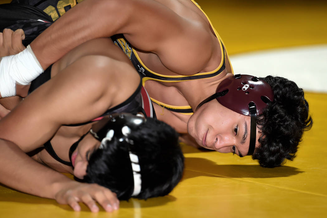 Peter Davis/Special to the Pahrump Valley Times Pahrump Valley senior Isaak Cruz takes control of Juan Vargas of Western on his way to a third-period pin at 145 pounds Wednesday night during the T ...