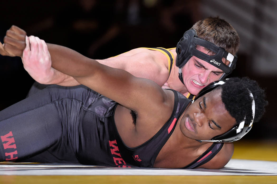 Peter Davis/Special to the Pahrump Valley Times The effort shows in Tristan Maughan's face as he battles Western's Lydell Hamon at 170 pounds Wednesday night. Maughan recorded a fall in 1:49 to pu ...